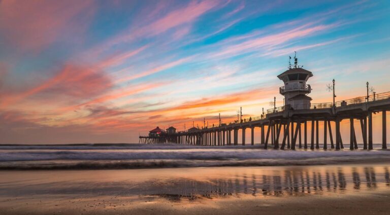 Incredible colors of sunset by Huntington Beach Pier, in the famous surf city in California
